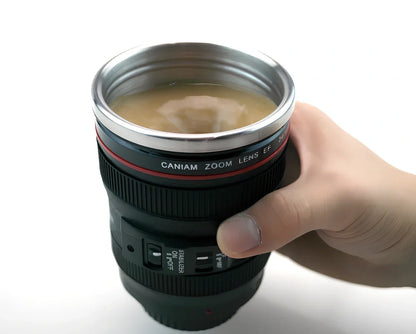 Self-stirring camera lens mug with stainless steel construction and automatic mixing button