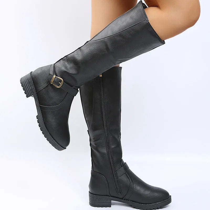 Women's black high knight boots with a square heel, round toe, and ankle buckle detail.