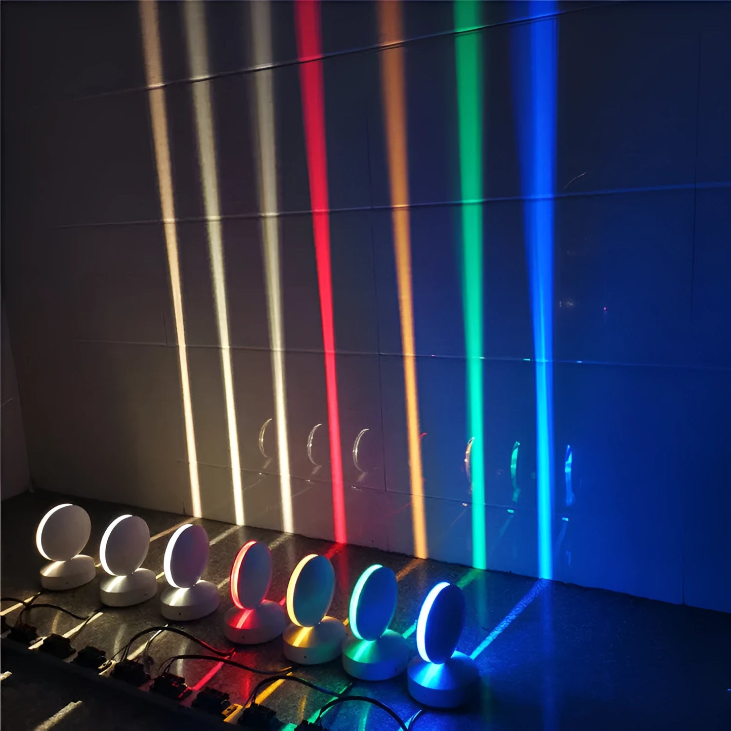 Aluminium and glass LED wall spotlight bar with colour change options, mounted on a corridor wall.