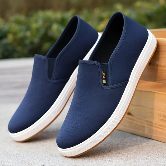 Men's low-top slip-on canvas casual shoes in black with a round toe and composite sole.