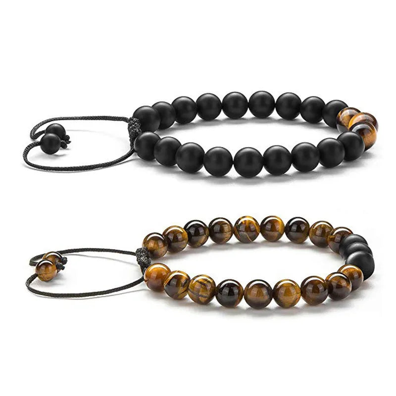 Tiger Eye and black agate geometric couple bracelets laid out as a matching set.