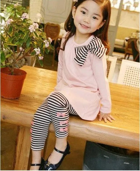 Pink cotton girls clothing set shown in sizes for child heights 110cm to 140cm.