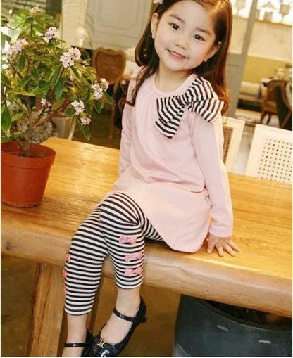 Pink cotton girls clothing set shown in sizes for child heights 110cm to 140cm.