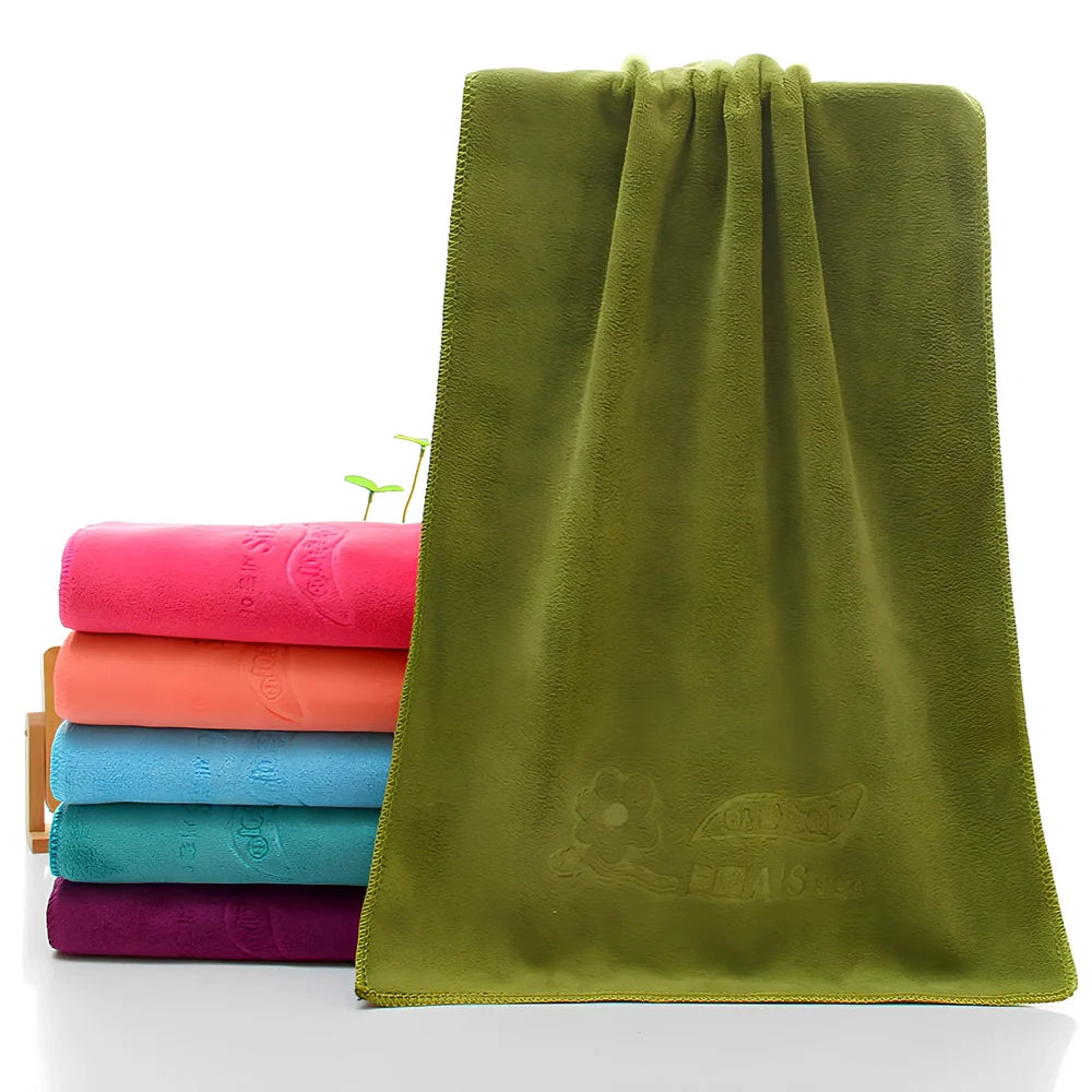 Blue microfiber towel with embossed texture measuring 70cm by 140cm with finished edges