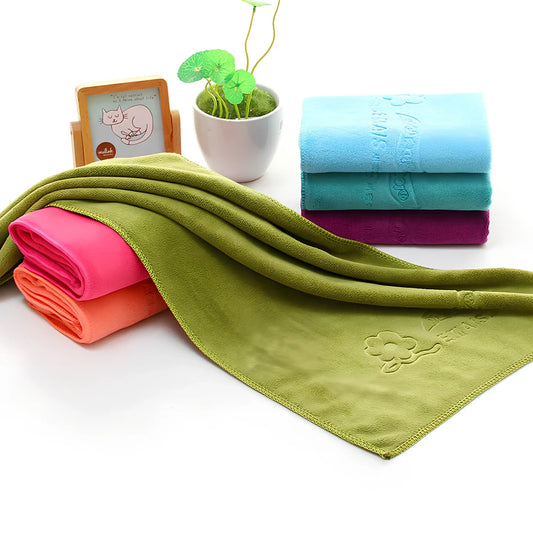 Blue microfiber towel with embossed texture measuring 70cm by 140cm with finished edges