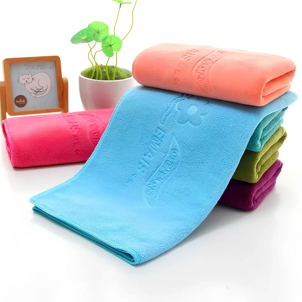 Blue microfiber towel with embossed texture measuring 70cm by 140cm with finished edges