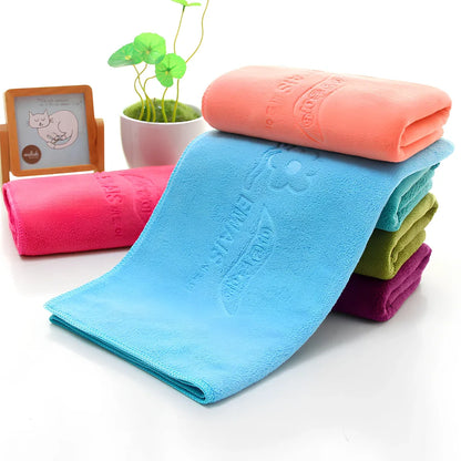 Blue microfiber towel with embossed texture measuring 70cm by 140cm with finished edges