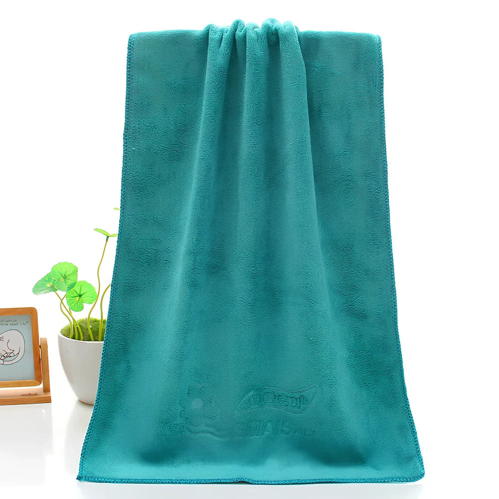 Blue microfiber towel with embossed texture measuring 70cm by 140cm with finished edges