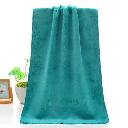 Blue microfiber towel with embossed texture measuring 70cm by 140cm with finished edges