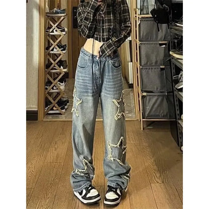 Blue high-waisted women's wide-leg denim jeans on a neutral background.