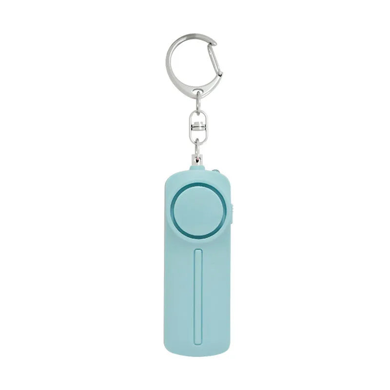 Compact pink self-defense alarm showing 86mm length with activation button and LED light