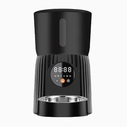 Black intelligent pet feeder with transparent food container showing kibble, digital display, and USB power cable