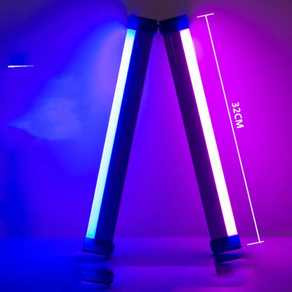 Blue rechargeable LED light tube with USB plug and push-button switch on a dark surface