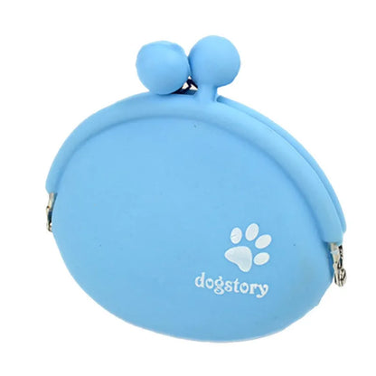Yellow silicone dog training treat pouch with a black hook and loop waist strap, shown with dog biscuits.