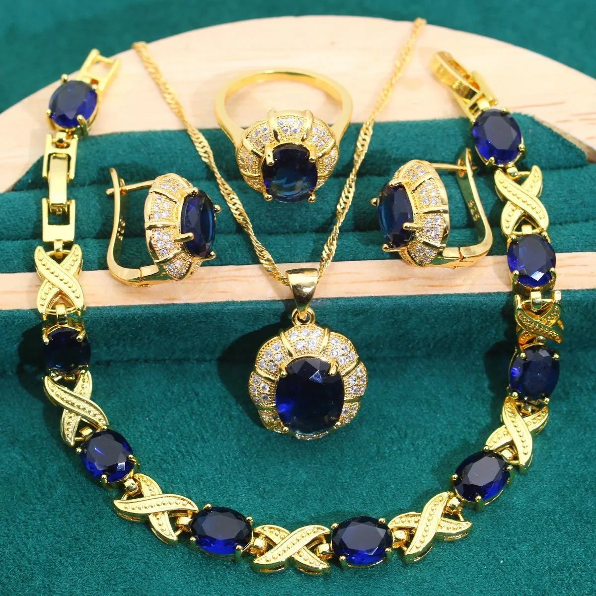 18k gold plated jewellery set with multi-colour synthetic cubic zirconia stones, including necklace, earrings, ring, and bracelet