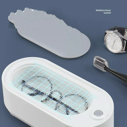 USB-powered glasses and watch cleaning device in dark green, pink, or white