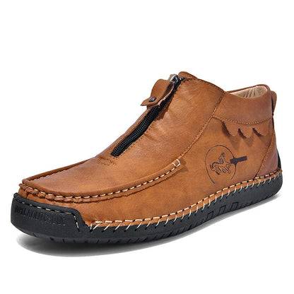 Men's slip-on loafers in black with round toe and sewing thread details, showing rubber sole