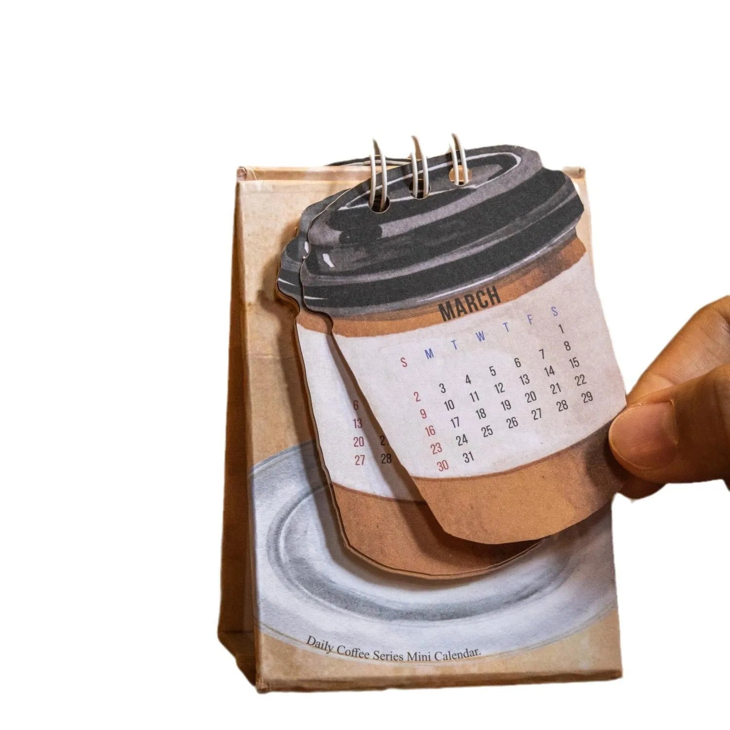 2025 mini desk calendar showing one of four designs: Coffee Time, Awake Time, Corner Perching, or Afternoon Lazy.