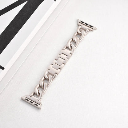 Silver metal link watch strap for Apple Watch with 22mm connectors on a grey background