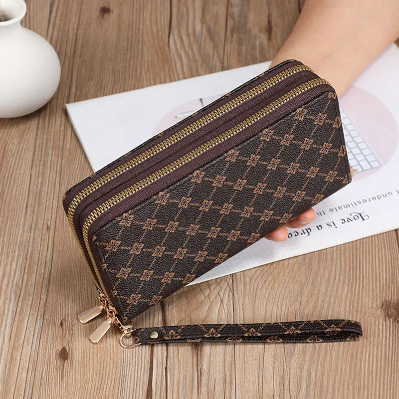 Long black retro-style PU leather wallet clutch with a printed pattern, showing a mobile phone pocket and a zippered coin purse.