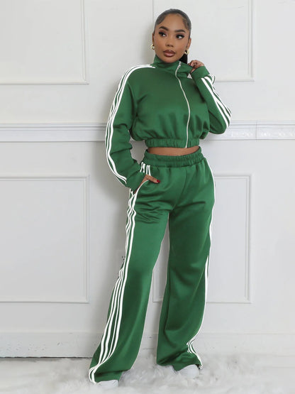 Grey striped streetwear two-piece suit set with zipper detailing on the top and trousers.