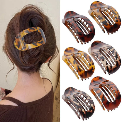 Six rose red plastic hair clips with frosted grip surface and geometric quadrilateral design