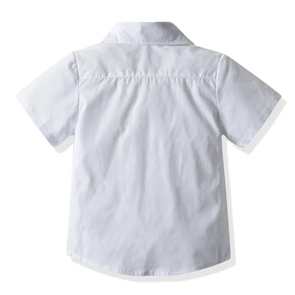 Boys' white short-sleeved shirt with suspender shorts set showing single-breasted closure and adjustable straps
