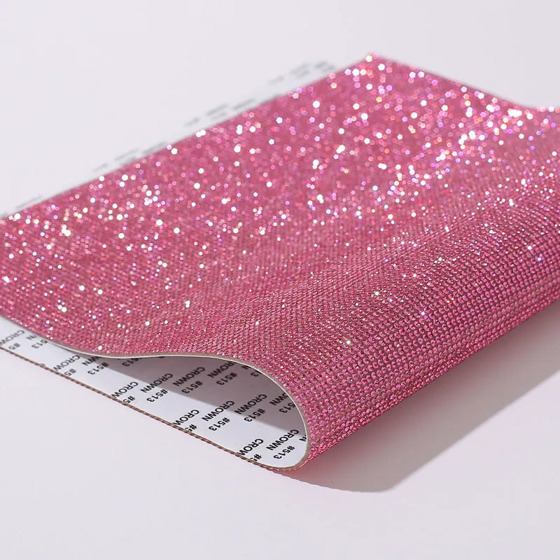 Rhinestone sticker net on backing sheet for hot drilling application to fabrics in multiple colour options