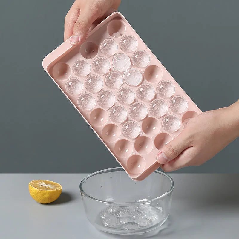 3D round ice moulds in sky blue or pink colours showing 18 and 33 grid options