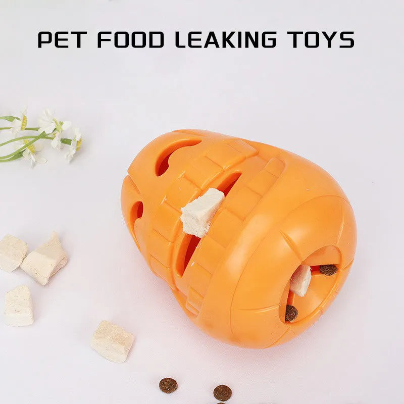 Halloween pumpkin-shaped dog chew toy with treat-dispensing funnel, made from orange thermoplastic rubber