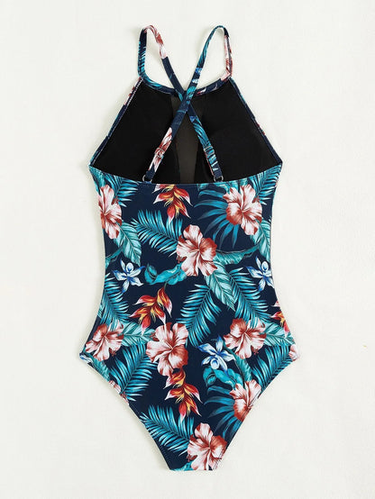 Women's deep V-neck one-piece swimsuit with a printed pattern in a solid colour.