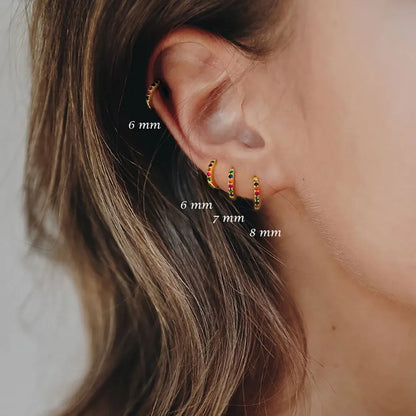 Circle zircon perforated stud earrings in gold, rose gold, silver colours with geometric design and multiple size options