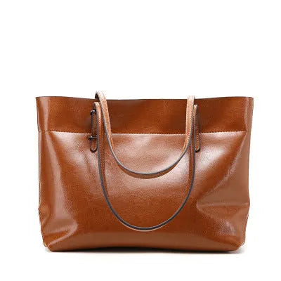 Leather cross-body handbag in Black colour with dimensions 30cm by 37cm by 13cm, showing internal pockets