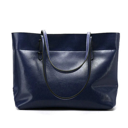 Leather cross-body handbag in Black colour with dimensions 30cm by 37cm by 13cm, showing internal pockets