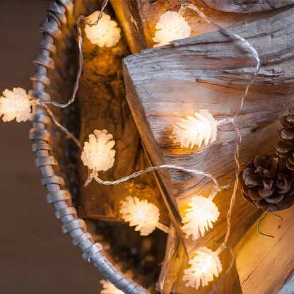 LED pine cone decorative light string with warm white illumination and battery operation