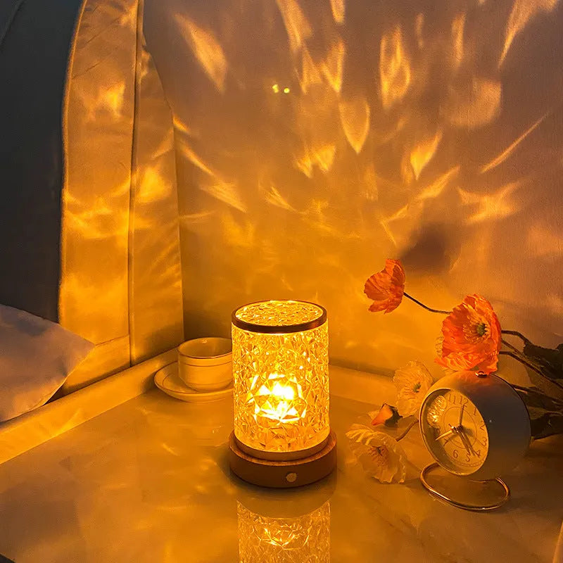 Rotating water ripple night light with acrylic construction and solid wood base measuring 9.5x14.5x10.5cm