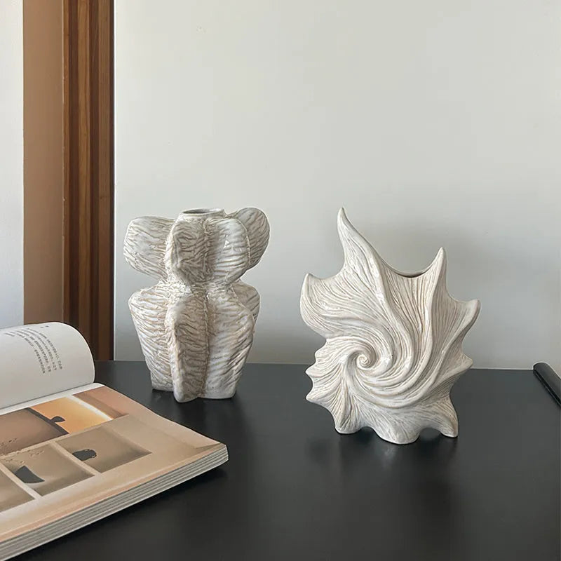 French art ceramic vase with coloured glaze in a European retro style, shown empty on a wooden surface.