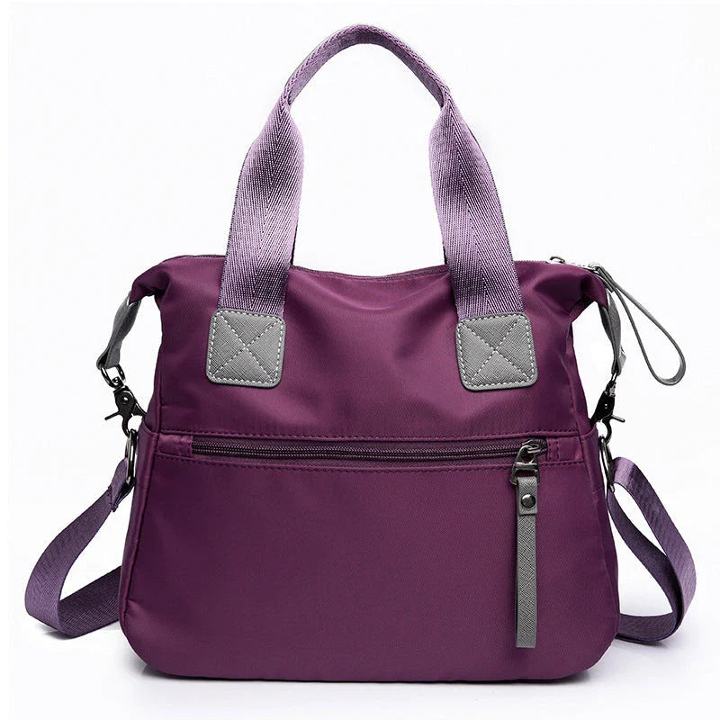 Versatile ladies handbag in various colors with multiple carry options, including handbag, shoulder bag, and crossbody styles, featuring durable construction and organizational pockets.