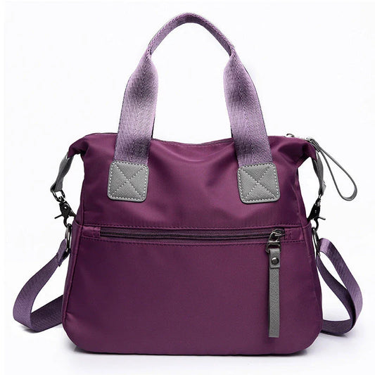 Versatile ladies handbag in various colors with multiple carry options, including handbag, shoulder bag, and crossbody styles, featuring durable construction and organizational pockets.