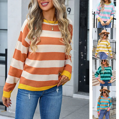 Women's loose fit striped long sleeve round neck sweater on a hanger.
