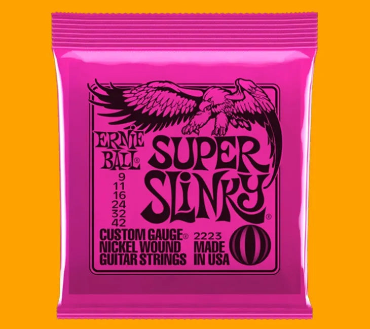 Coils of nickel-plated electric guitar strings and bass strings showing their metallic shine.