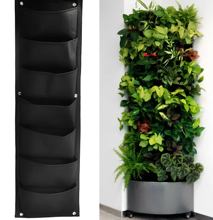 Vertical wall garden planting bag with 18 pockets hanging on outdoor wall with growing herbs