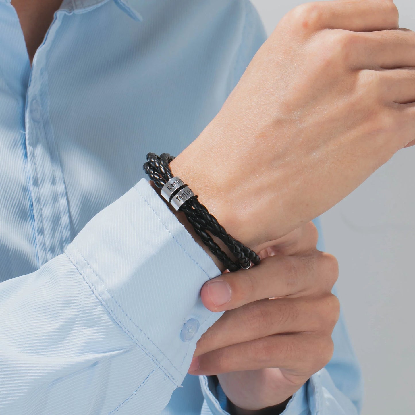 Personalized men's braided leather bracelet with stainless steel beads and custom name charm