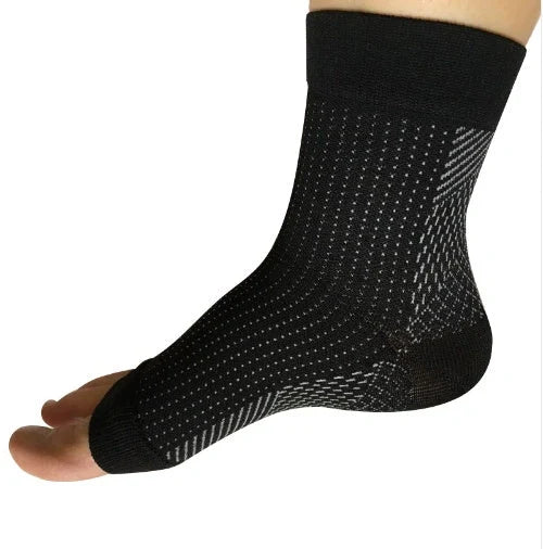Anti-fatigue compression foot sleeves for men and women in black, red, and white
