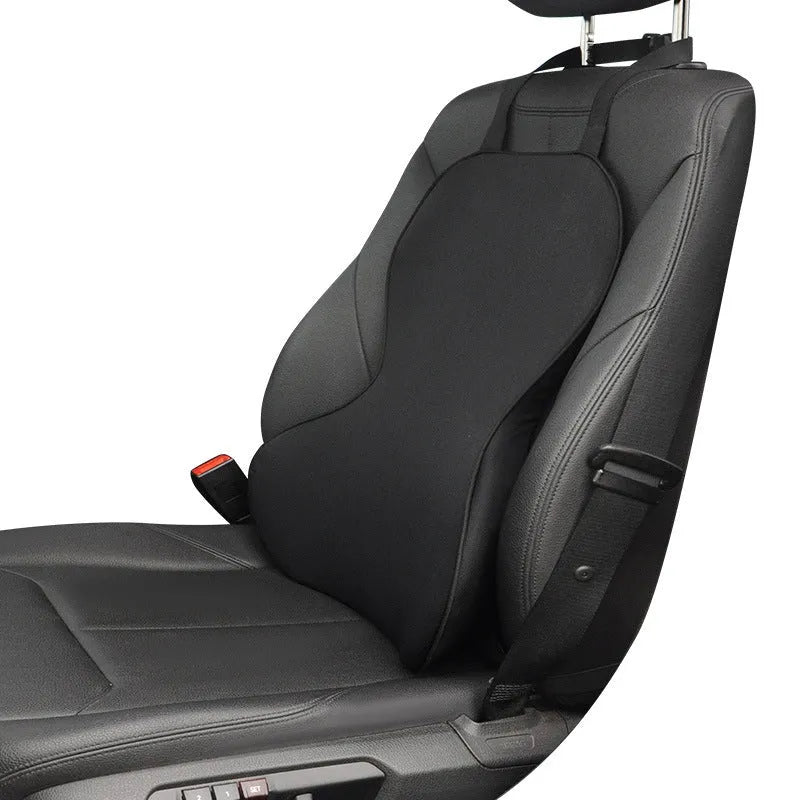 Memory cotton car lumbar support cushion in grey, showing its contoured shape on a car seat.