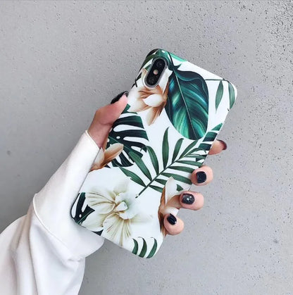 Retro floral iPhone case with banana leaf and flowers design in leaves colour on a soft TPU back cover.