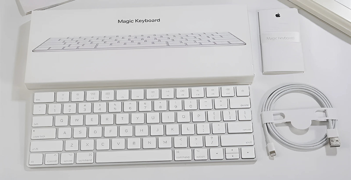 White Apple G6 ultra-thin metal Bluetooth wireless keyboard on a desk