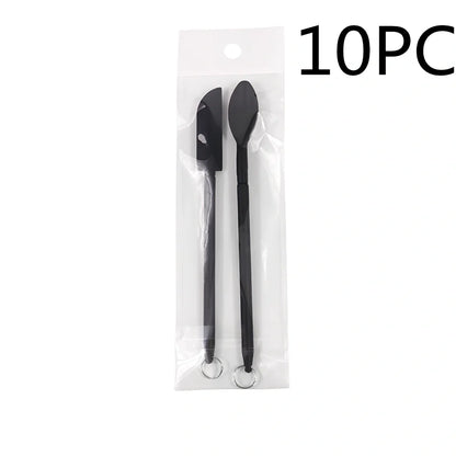 Retractable silicone cosmetic spatula extended to 15cm with scraper tool for product application