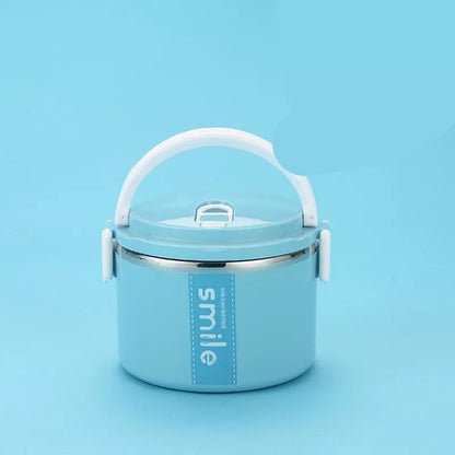 Stainless steel lunch box with built-in spoon, leak-proof design, available in green, pink, and blue