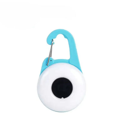 Blue USB-rechargeable LED dog collar light with adjustable silicone strap showing four lighting modes and waterproof stopper